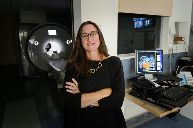 Inge-Marie Eigsti with the new FMRI at the Brain and Imaging Center on Sept. 28, 2015. (Peter Morenus/UConn Photo)